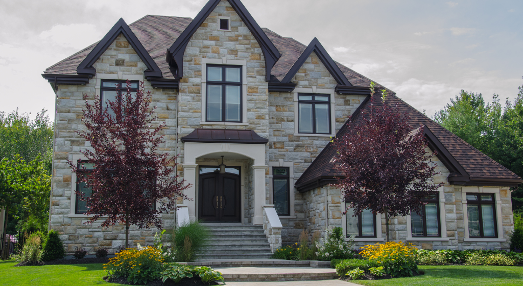 Luxury Cheshire mansion with gated driveway, grand façade and landscaped grounds